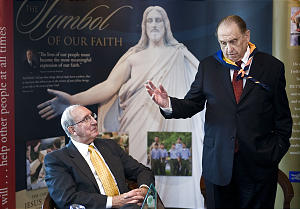 Vaughn J. Featherstone (left) takes in a 2009 Young Men's address by LdS President Thomas S. Monson