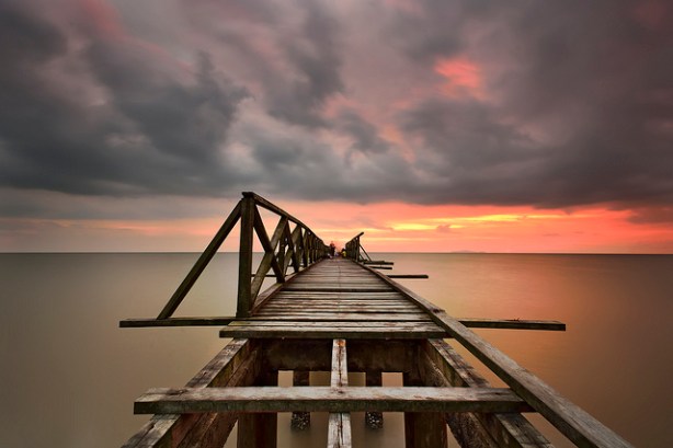 (c) Tuah Roslan http://jellyfields.com/photo/8936211435/tuah-roslan,the-confusion-bridge,ocean-life-travel-bridge-sunset-sea-sky-sun-lake-holiday-tourism-nature-silhouette "Confusion Bridge" by Tuah Roslan