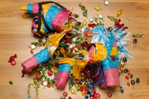 credit: Getty Images Smashed donkey pinata on floor with candy